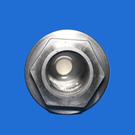 Close-up of a silver circular metal component with an inner opening, set against a bright blue background.