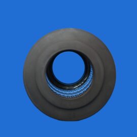 Close-up of a dark circular ring (donut-shaped) against a solid blue background, showing inner blue hole area.