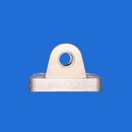 Close-up of a silver metal bracket with a circular hole, set against a blue background.