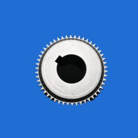 Close-up of a silver gear with sharp teeth against a solid blue background.