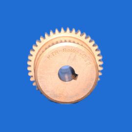 Close-up of a copper gear against a solid blue background.