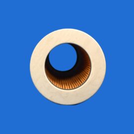 Close-up of a large metal washer with a central hole against a solid blue background.