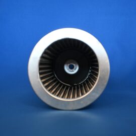 Close-up of a jet engine turbine with a circular metal housing and dark blades against a blue background
