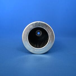 Close-up of a shiny silver metal cylinder with a dark interior against a bright blue background.