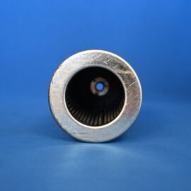 Close-up of a silver metal cylinder with a dark hollow center against a blue background.