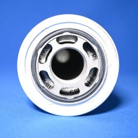 Close-up of a metallic camera lens barrel with circular openings against a bright blue background, macro shot.