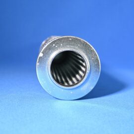 Close-up of a shiny metal circular flange with a dark inner tube on a bright blue surface for a product shot.