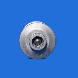 Close-up of a silver circular mechanical knob against a solid blue background.
