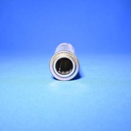 Metal cylindrical pipe protruding from the bottom edge against a blue sky.
