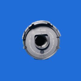 Close-up of a gray camera lens cap with white text, positioned at the bottom-right on a blue background.