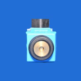 Close-up of a blue handheld tool with a black rectangular top and a gold circular dial against a solid blue background.