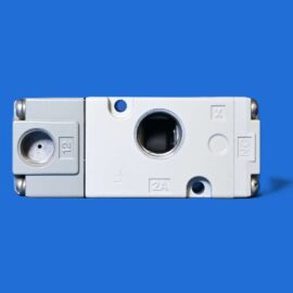 Close-up of a white circuit breaker against a solid blue background, showing its terminals and screws at the edges.