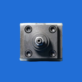 Close-up of a gray metal block with circular recesses and bolts on a solid blue background, likely a mechanical component.
