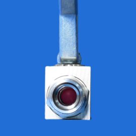 Close-up of a metallic valve with a red circular center against a solid blue background.