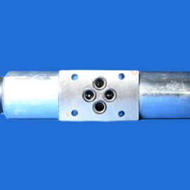 Close-up of a metal pneumatic actuator housing with mounting holes against a solid blue background.