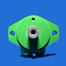 Close-up of a green mechanical joint with a metal bolt against a blue background, highlighting the central shaft and mounting holes.