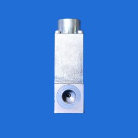 Close-up of a vertical metallic fixture with a cylindrical top and a circular valve at the bottom, set against a solid blue background.