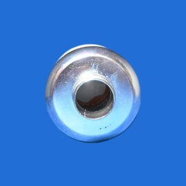 Close-up of a chrome plumbing fitting with a circular hollow center on a solid blue background
