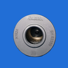 Close-up of a silver circular metal component with a central hole and engraved markings on a solid blue background.