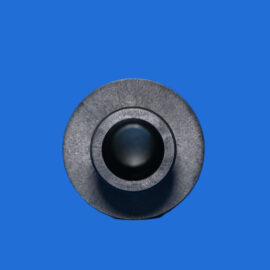 Close-up of a circular gray speaker component with a black center against a solid blue background