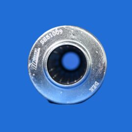 Close-up of a silver metal bearing ring with a dark inner bore on a blue background.