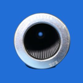 Close-up of a chrome cylindrical metal opening with a threaded interior against a blue background.