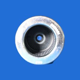 Macro shot of a metal circular fitting with a ridged inner bore and central opening, on a solid blue background.