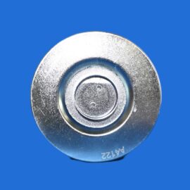 Close-up of a shiny, circular metal disc with concentric rings set against a blue background.