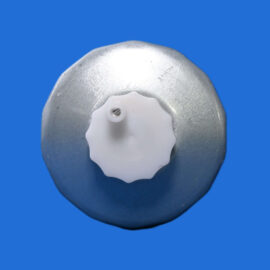 Close-up of a silver metal valve with a white plastic knob on top, set against a solid blue background, viewed from above.