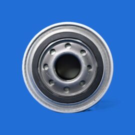 Close-up of a metal circular bearing with holes, set against a solid blue background.