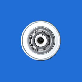Partial view of a metallic bearing resting on a bright blue background, occupying the bottom-right corner.