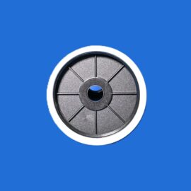 Close-up of a metallic circular spool with eight spokes on a blue background.