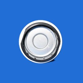 Close-up of a silver circular metal component with concentric rings on a solid blue background