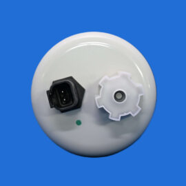 Close-up of a white circular device with a black electrical connector and a white gear against a blue background.