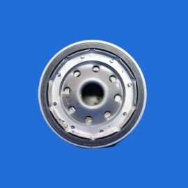 Close-up of a circular metal wheel hub with bolt holes, set against a solid blue background