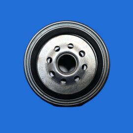 Close-up of a shiny metal car wheel hub with six bolt holes, set against a solid blue background.