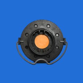 Close-up of a black circular mechanical component with an orange center against a solid blue background.