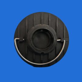 Close-up of a black ribbed circular mechanical part with two metal handles on a blue background.