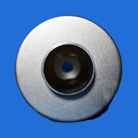 Close-up of a metallic, circular bearing hub with a central hollow opening against a blue background.