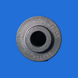 Close-up of a gray metal weight plate with a central hole, set against a solid blue background.