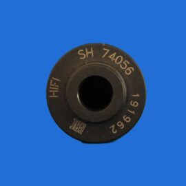 Close-up of a dark circular dial with white numbers around the rim against a blue background
