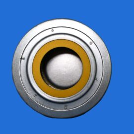 Close-up of a metal bearing with a yellow inner ring on a blue background.