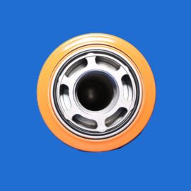 Close-up of a metal ball bearing with an orange outer race set against a solid blue background.