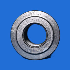 Close-up of a metallic bearing ring set against a solid blue background.