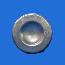 Close-up of a worn silver metal ring or ferrule with the engraving 'SH65395' against a solid blue background.