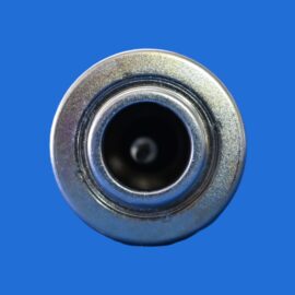 Close-up of a shiny metal circular opening with concentric rings against a solid blue background, resembling a nozzle or lens.