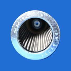 Close-up of a metal faucet aerator with a circular opening and fine mesh against a blue background.