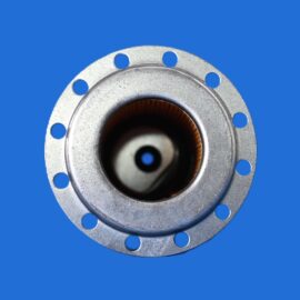 Metal flange close-up showing a circular metal ring with multiple bolt holes around the edge against a bright blue background, center bore visible.