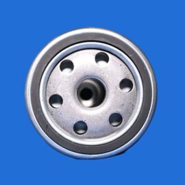 Close-up of a metal bearing or pulley with circular holes on a blue background.