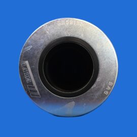 Close-up of a weathered metal circular flange with a black inner hole against a blue background.